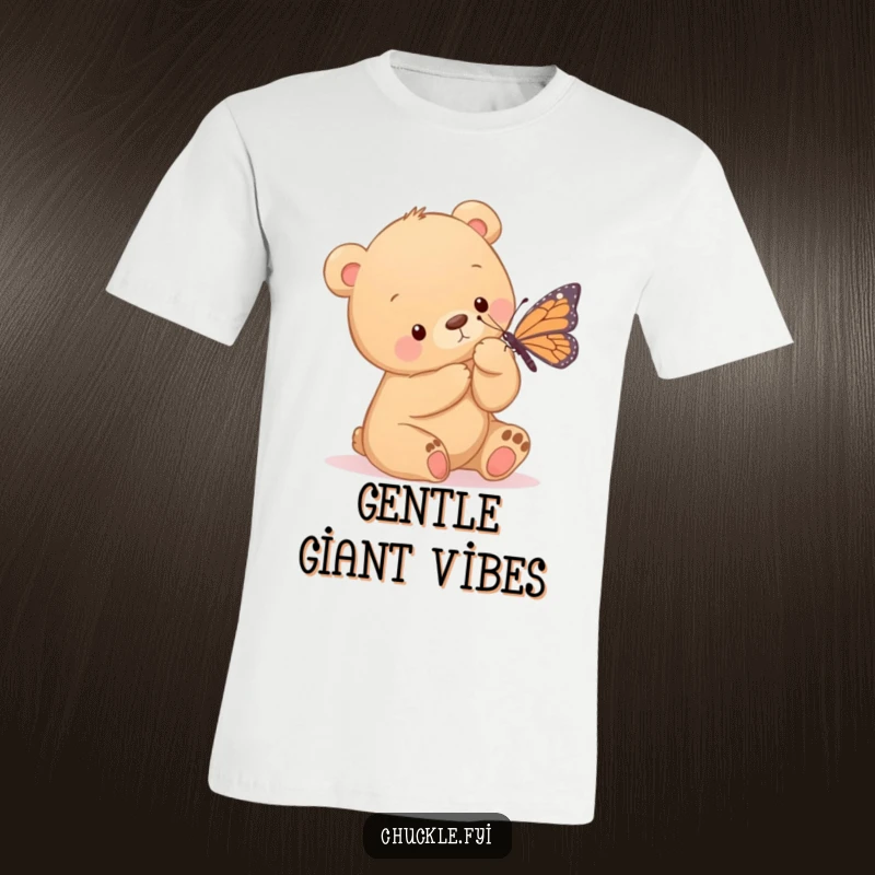 Funny t-shirt showing a sweet bear cub gently tickling a butterfly with its paw, expressing innocent fun and interspecies friendship.